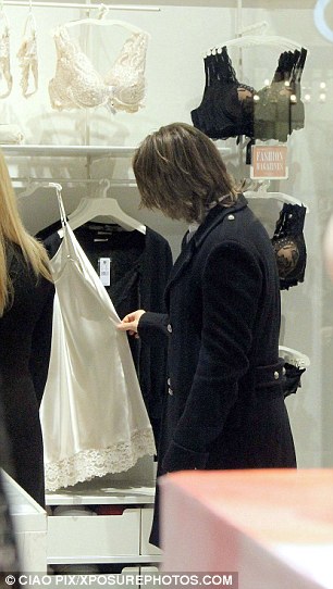 Raffaele Sollecito was seen shopping for lingerie in Rome with a blonde companion two weeks after he was cleared of killing British student Meredith Kercher