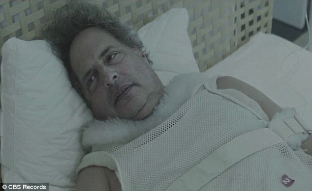 Ouch: The former Saturday Night Live castmember realise that it was all a dream while strapped to a hospital bed