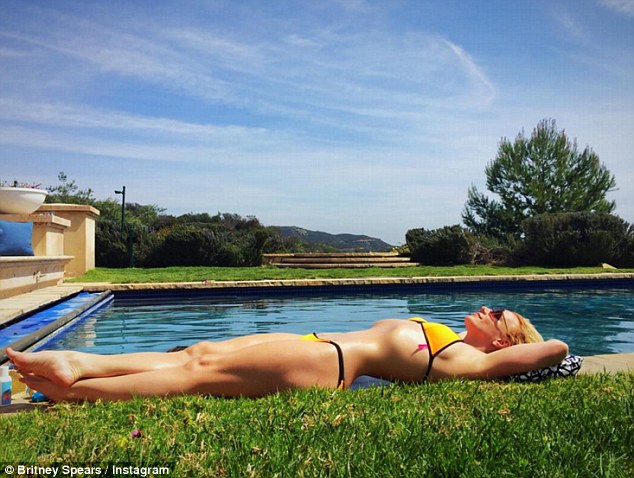 Altered: The pop star was accused of photoshopping this bikini shot, which she shared on Instagram earlier this week. Fans pointed out that the arch in her back appeared to be missing the pool tile