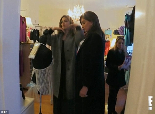 Perusing: Caitlyn is seen checking out a sheer lingerie set as the women disperse around the store