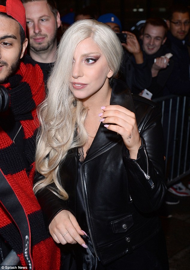 Leather and lace: Wearing a lingerie-inspired nightie and a black biker jacket, the songstress cut a trendy figure