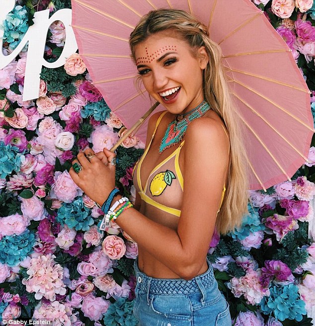 Changing it up: For the second weekend of the festival she slipped into another sheer bra and a pair of denim mini shorts