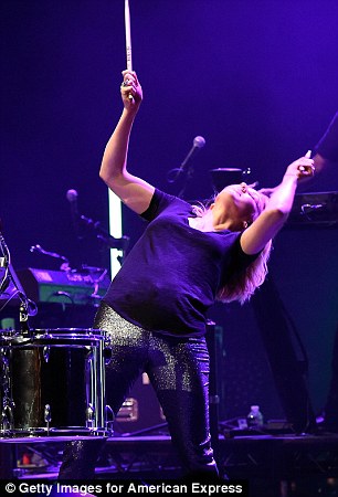 Multi-talented musician: She showcased her drum-playing talents while her band-member took a short break