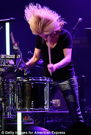 Multi-talented musician: She showcased her drum-playing talents while her band-member took a short break