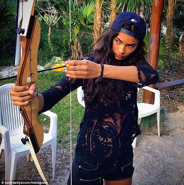 Revealing! Victoria's Secret Kelly Gale set hearts racing in a sheer, black top, wearing nothing but a white bra underneath as she continues to enjoy her loved-up getaway in Tulum, Mexico