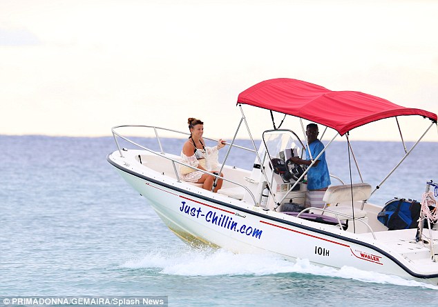 Hold on tight! Coleen was clutching on to the boat, dubbed 'Just chilling'