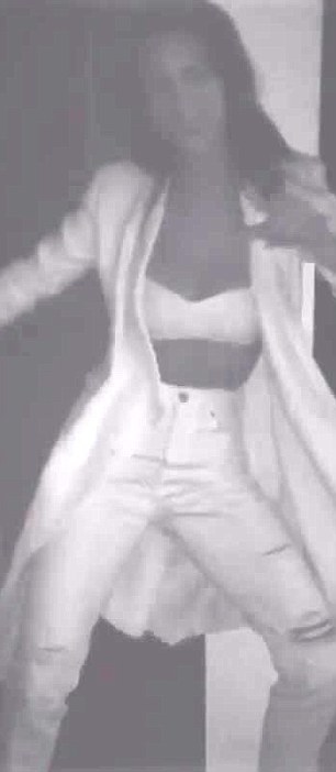 Loving life: While the video had no caption attached, she also posted another snap of her look, writing, 'all white night' alongside it