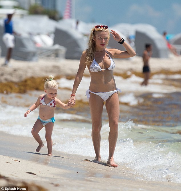 Mother daughter bonding: The creator of The Method exercise regime later took her three-year-old daughter Penelope down to the waters edge to enjoy some playtime