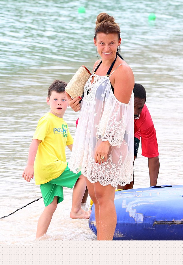 With her boy! Defying belief that she gave birth so recently, the stunning star looked simply sensational in her monochromatic ensemble which highlighted her fabulous figure