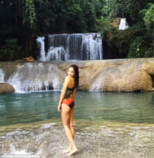 Model behaviour: Shanina showed off her enviable physique while chilling out in a number of bathers during her holiday with boyfriend Tyson Beckford in Jamaica on Sunday