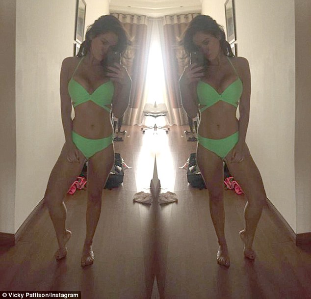 Green goddess: Vicky  put on an incredibly busty display in neon bikini for her latest Instagram snap on Monday